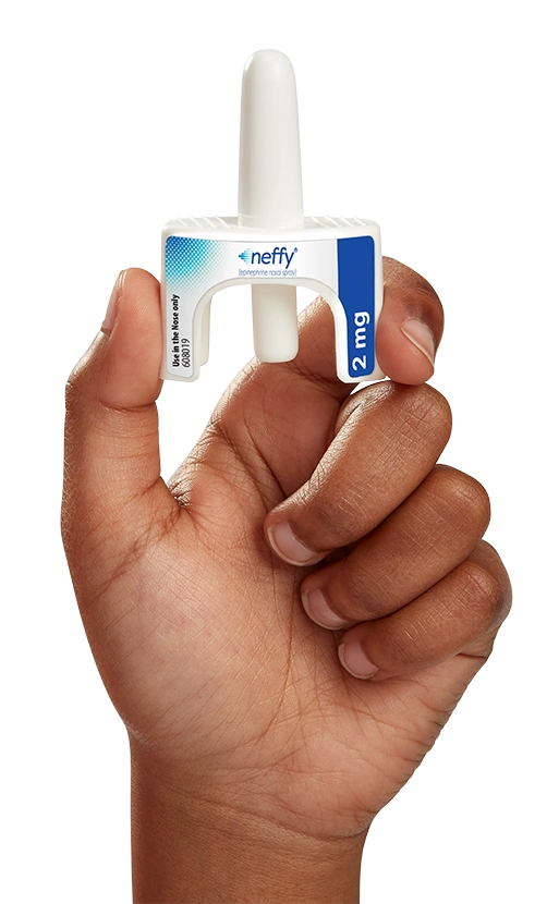 Hand holding neffy intranasal epinephrine device