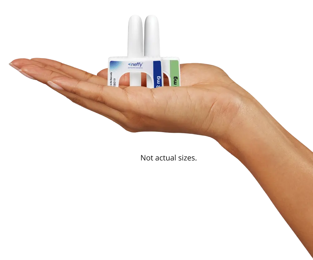 hand holding neffy 2 mg and 1 mg devices